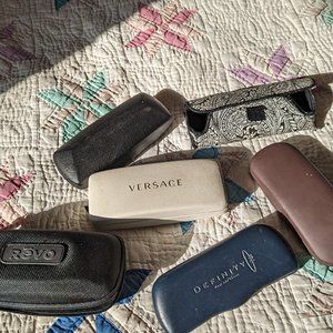 A variety of 6 hard and soft shell eyeglass caases.